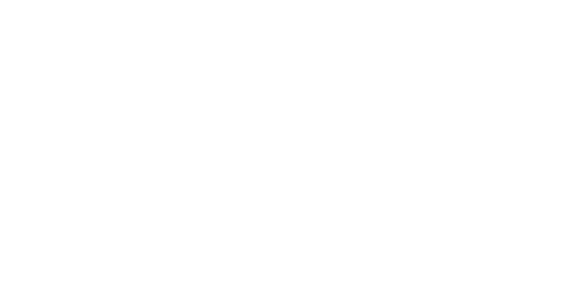 A person in a suit holding a red puzzle piece fitting it into a white puzzle.